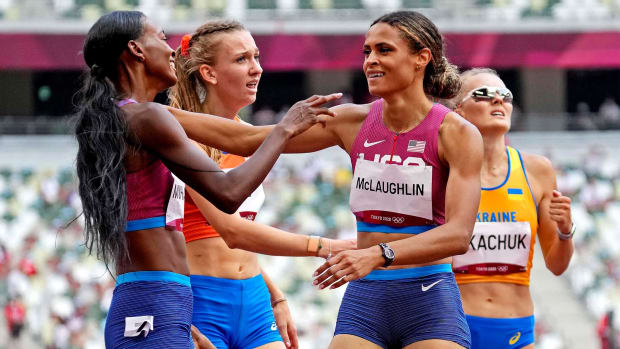 Aug 4, 2021; Tokyo, Japan; Dalilah Muhammad (USA) celebrates winning the silver medal and Sydney McLaughlin (USA) celebrates winning the gold medal in the women's 400m hurdles final during the Tokyo 2020 Olympic Summer Games at Olympic Stadium.